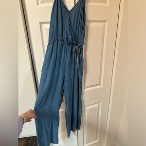 Sienna Sky denim colored jumpsuit with bow